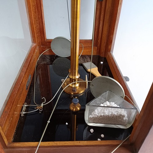 589 - A set of laboratory scales, in a mahogany case, 37 cm wide