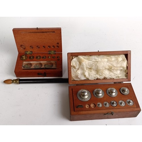 589 - A set of laboratory scales, in a mahogany case, 37 cm wide