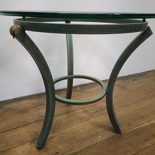 716 - A pair of glass top side tables, on metal bases, 60 cm diameter (2)