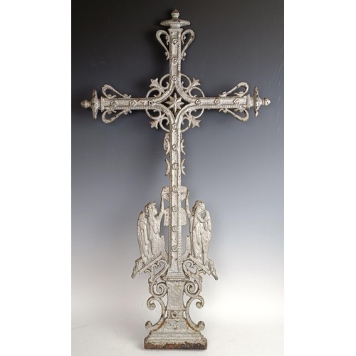 551 - A cast iron crucifix, 83 x 40 cm, a silver plated cross, 60 cm high, and a painted metal cross, 47 c... 