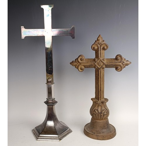 551 - A cast iron crucifix, 83 x 40 cm, a silver plated cross, 60 cm high, and a painted metal cross, 47 c... 