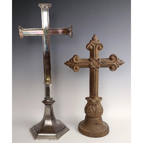 551 - A cast iron crucifix, 83 x 40 cm, a silver plated cross, 60 cm high, and a painted metal cross, 47 c... 