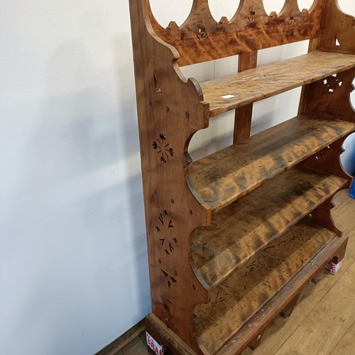 725 - A walnut bookcase, with carved decoration, 97 cm wide