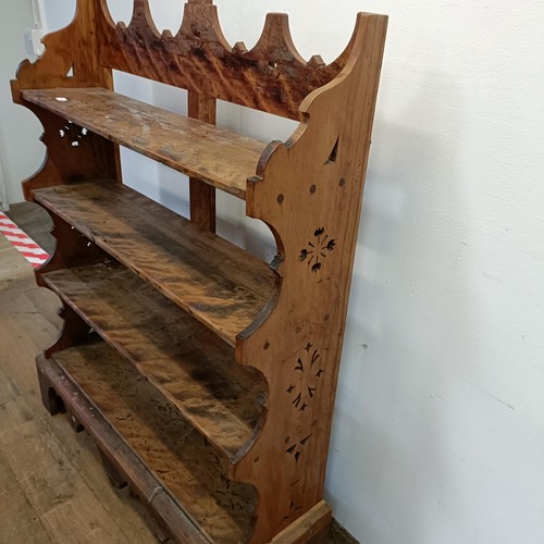 725 - A walnut bookcase, with carved decoration, 97 cm wide