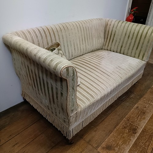 738 - An Edwardian two seater settee, on tapering square legs, 135 cm wide