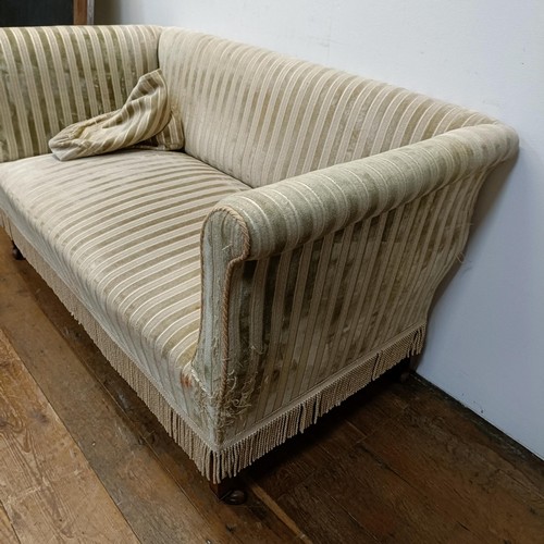 738 - An Edwardian two seater settee, on tapering square legs, 135 cm wide