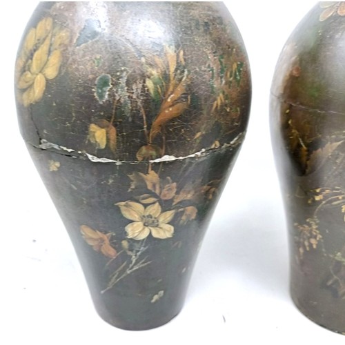 604 - A pair of papier mache painted urns, decorated flowers, 30 cm high