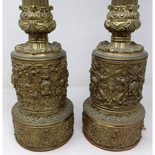 605 - A pair of brass lamps, with neo-classical decoration, 53 cm high (2)