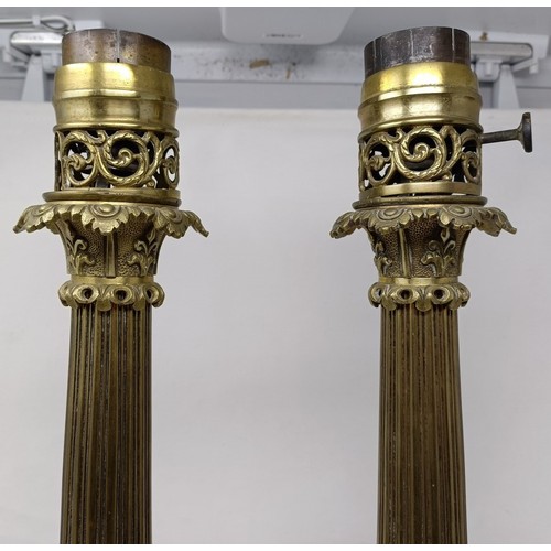 605 - A pair of brass lamps, with neo-classical decoration, 53 cm high (2)