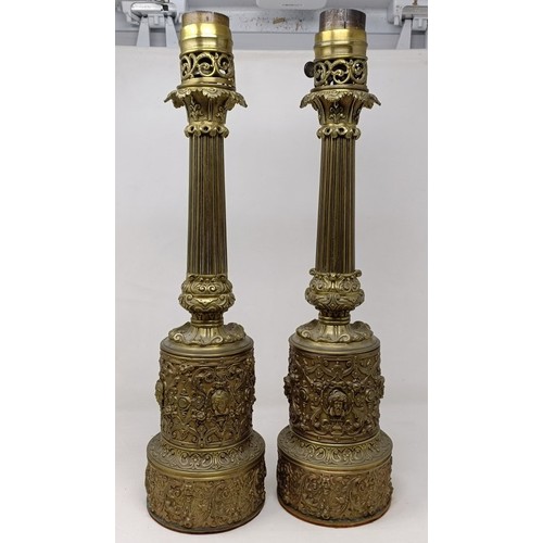 605 - A pair of brass lamps, with neo-classical decoration, 53 cm high (2)