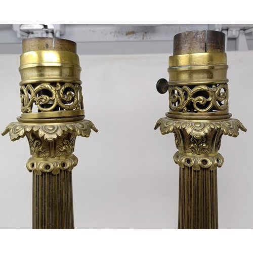 605 - A pair of brass lamps, with neo-classical decoration, 53 cm high (2)