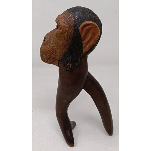 608 - A novelty treen nutcracker, in the form of a monkey