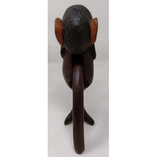 608 - A novelty treen nutcracker, in the form of a monkey