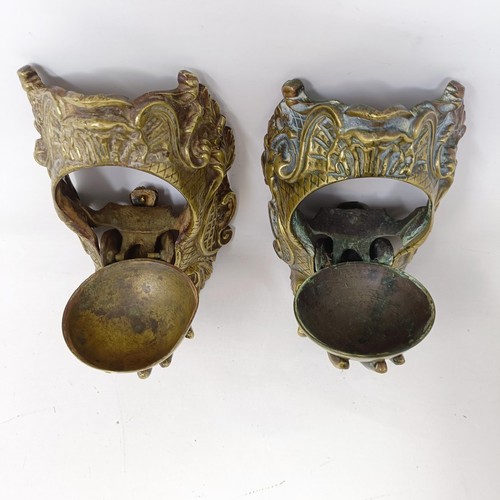 640 - A pair of unusual late 19th/early 20th century brass wall mounts, with drop down compartments in the... 