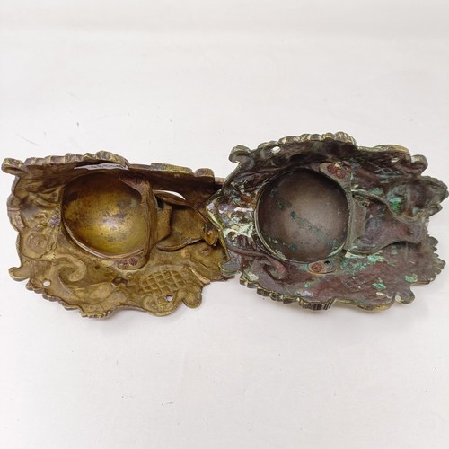 640 - A pair of unusual late 19th/early 20th century brass wall mounts, with drop down compartments in the... 