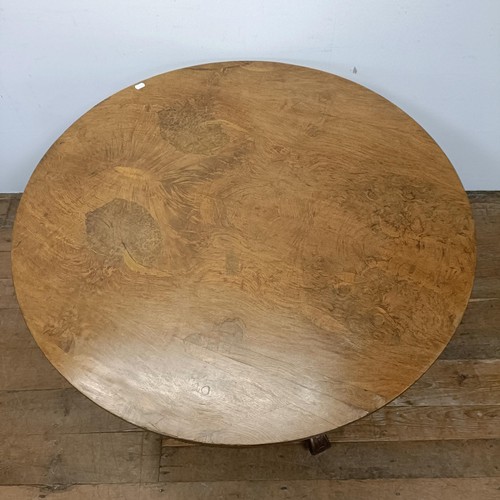 757 - A pollard oak centre table, on a carved column support to shaped legs, 123 cm diameter