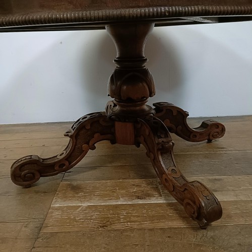 757 - A pollard oak centre table, on a carved column support to shaped legs, 123 cm diameter