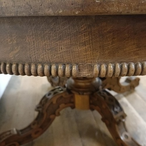 757 - A pollard oak centre table, on a carved column support to shaped legs, 123 cm diameter