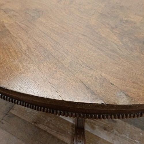 757 - A pollard oak centre table, on a carved column support to shaped legs, 123 cm diameter