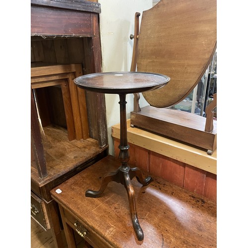 761 - An oak tilt top table, 82 cm diameter, two occasional tables, a cheval mirror, three bedroom mirrors... 