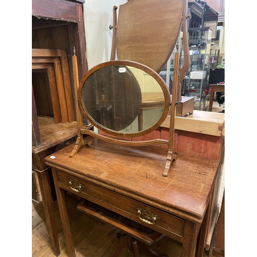 761 - An oak tilt top table, 82 cm diameter, two occasional tables, a cheval mirror, three bedroom mirrors... 