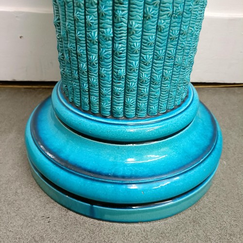 439 - A Burmantofts blue glazed jardinière stand, 60 cm high x 33 cm wide