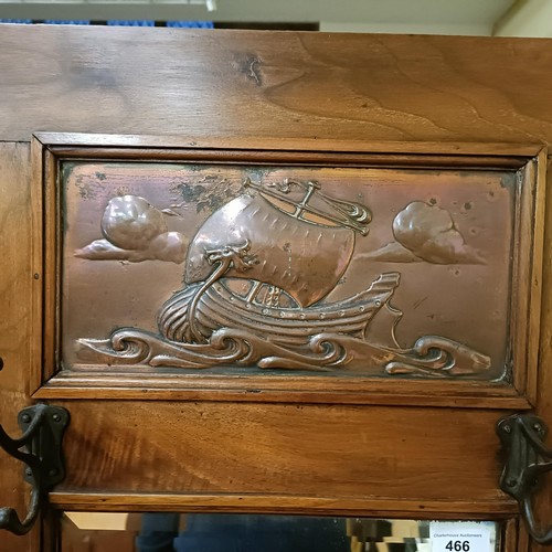 466 - An early 20th century Arts & Crafts oak hallstand, inset with two copper plaques, decorated ship... 