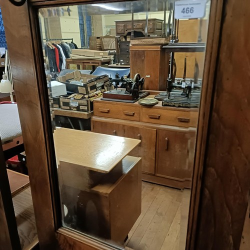 466 - An early 20th century Arts & Crafts oak hallstand, inset with two copper plaques, decorated ship... 