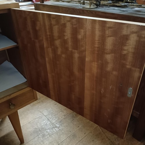 474 - A 1970s/80s dining room suite, comprising a sideboard, 164 cm, an extending dining table and six din... 