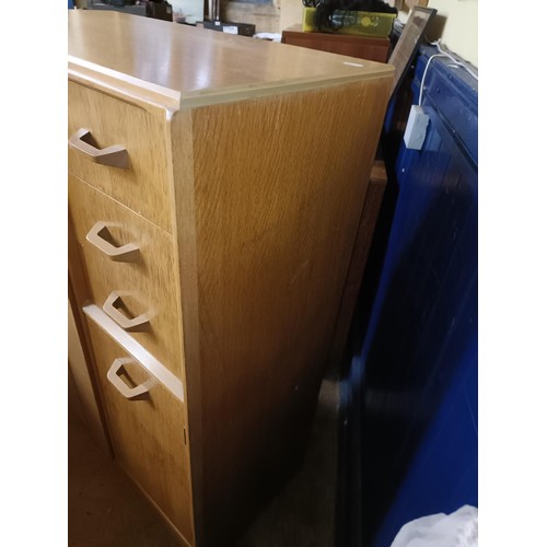 484 - An Ernest Gomme gentleman's dresser, with a cupboard door and drawers, 89 cm wide