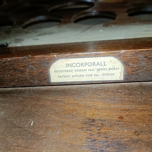 492 - An early 20th century walnut coffee table, set with two compartments, one for records and one for bo... 