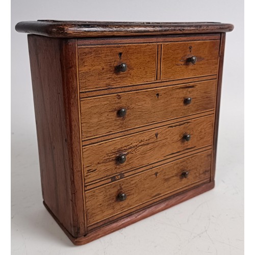 540 - A miniature/apprentice piece tripod table, and a money box, in the form of a chest of drawers (2)