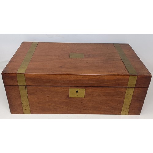 624 - A mahogany and brass bound writing box, 46 cm wide, a set of three wall lights, and three prints