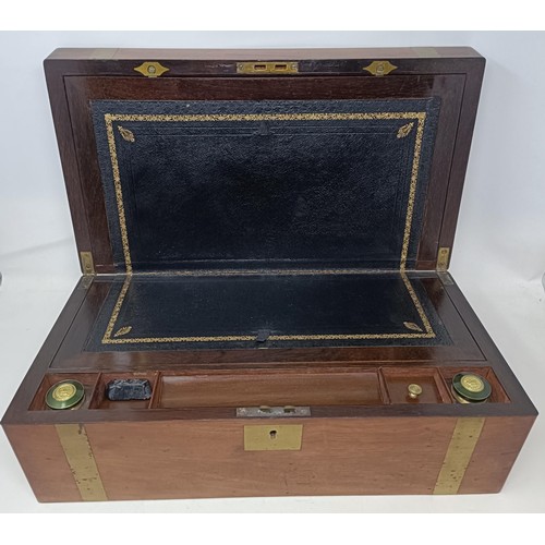 624 - A mahogany and brass bound writing box, 46 cm wide, a set of three wall lights, and three prints