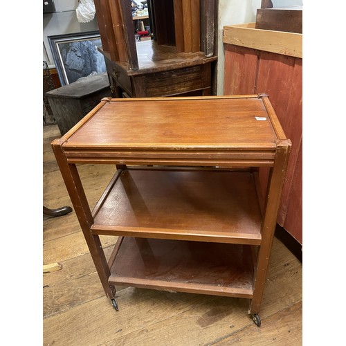 767 - A mahogany glazed bookcase, 82 cm wide, a teak trolley, and two chairs (4)