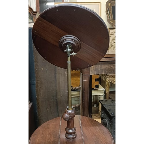 721 - A 19th century mahogany adjustable washstand, on a tripod base, 42 cm diameter