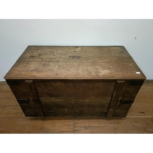 775 - An oak and metal bound chest, 112 cm wide