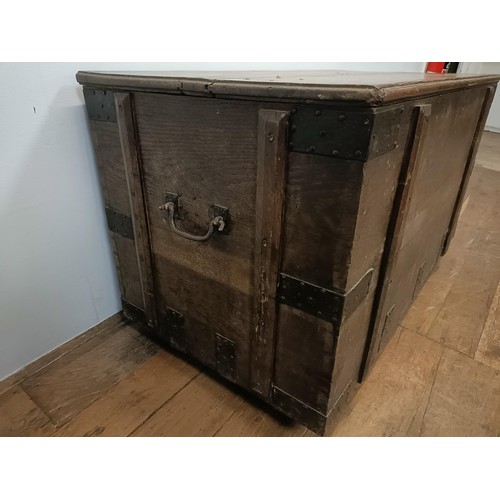 775 - An oak and metal bound chest, 112 cm wide