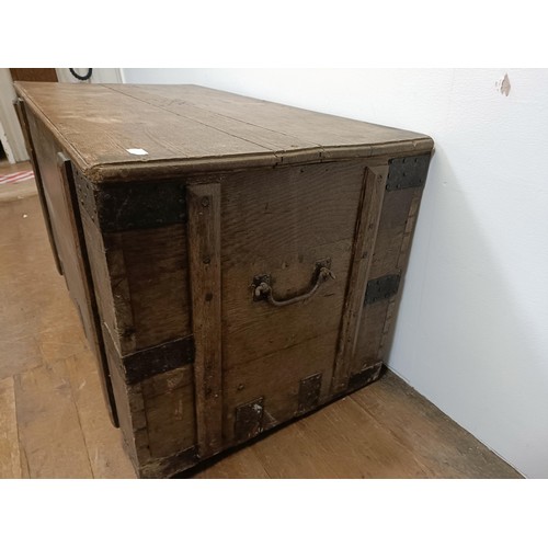 775 - An oak and metal bound chest, 112 cm wide