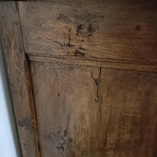 778 - A 19th century French inlaid oak dresser, having three drawers and three cupboard doors, 194 cm wide