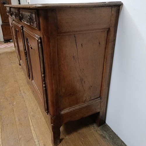 778 - A 19th century French inlaid oak dresser, having three drawers and three cupboard doors, 194 cm wide