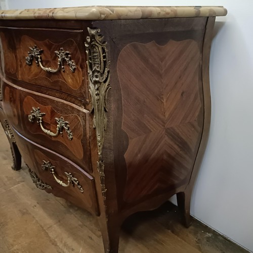 779 - A Continental parquetry inlaid rosewood bombe commode, the marble top above three drawers, with gilt... 