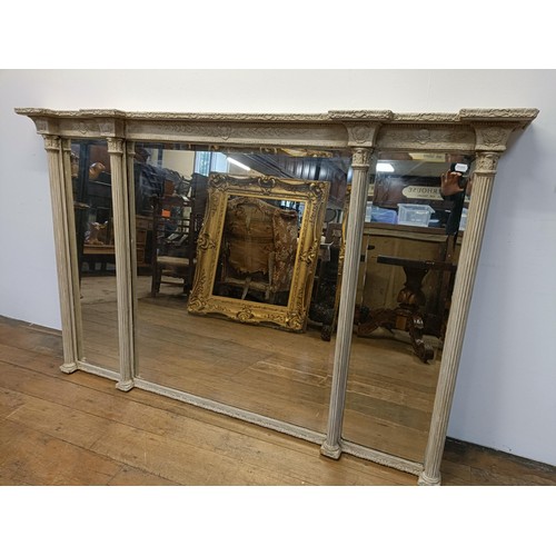 784 - A painted triple overmantel mirror, with Corinthian column supports, 116 x 180 cm