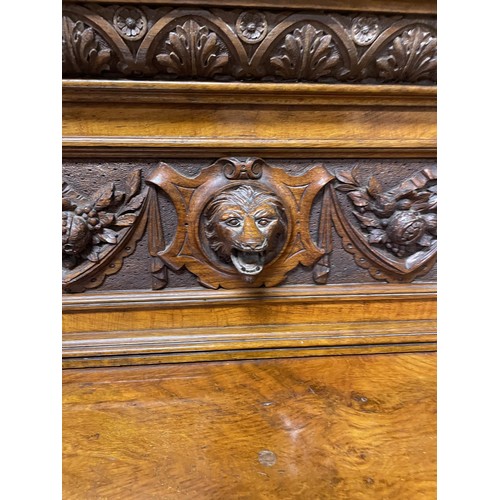 788 - A late 19th/early 20th century walnut buffet, by James Shoolbred & Co, having a carved raised ba... 