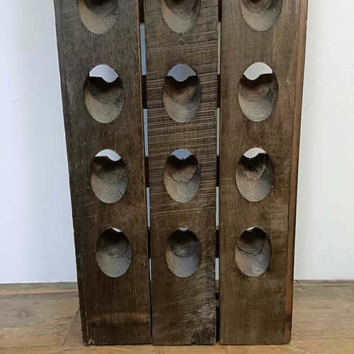 789 - A stained wood wall mounted wine rack, 150 x 37 cm