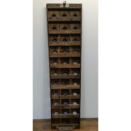 789 - A stained wood wall mounted wine rack, 150 x 37 cm