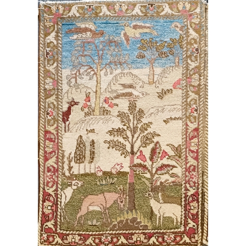 805 - A pair of small rugs, decorated landscapes and animals, 79 x 55 cm (2)