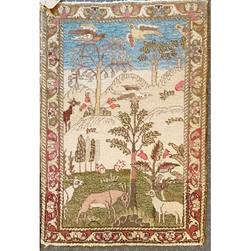 805 - A pair of small rugs, decorated landscapes and animals, 79 x 55 cm (2)