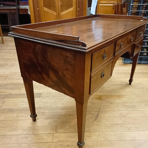 825 - A mahogany dressing table, with five drawers, 125 cm wide