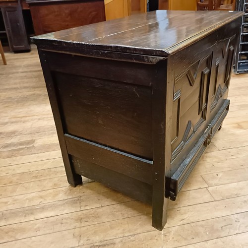 830 - An oak mule chest, with a geometric moulded front, 96 cm wide